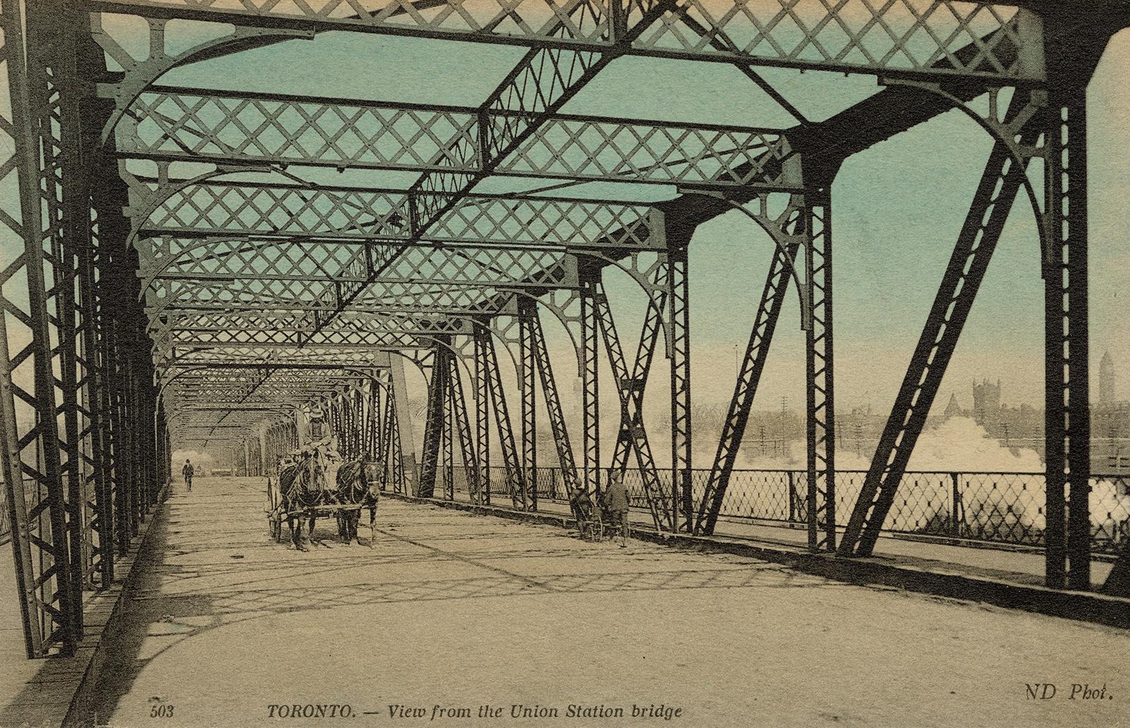 Colour photo postcard depicting the inside of the Union station bridge with a horse-drawn carri…