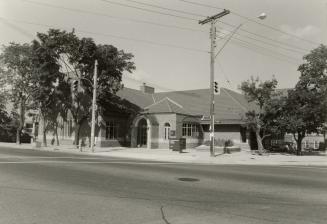 Picture of library building on street corner. 