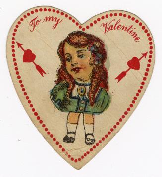 A small, flat, heart-shaped card with red writing. A girl is pictured at the center. On either  ...