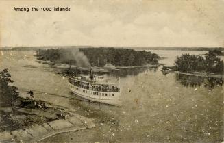 Black and white photograph of a steamboat loaded with passengers traveling up a body of water w ...