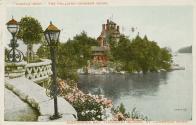 Colorized photograph of a large home on an island in the middle of a river taken from a terrace…