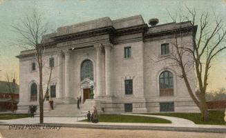 Picture of large two storey public library building with pillars. 