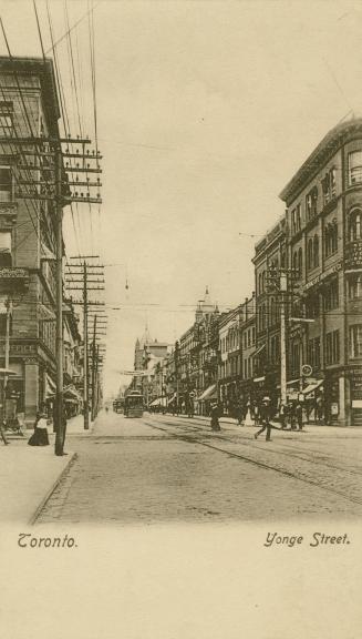 Sepia-toned photo postcard depicting a view of Yonge Street looking north from King Street with ...