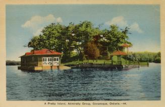 Colorized photograph of a boathouse beside a house on a small island in the middle of a river.