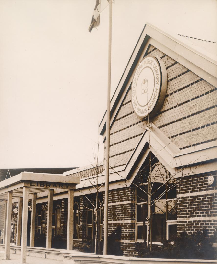 Picture of library building with peaked roof. 