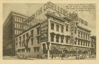 Sepia-toned postcard depicting the exterior corner of a 3-story fur store on Yonge Street. Ther ...