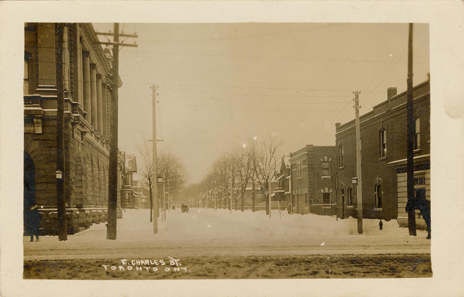 Sepia-toned photo postcard with a white border, depicting a view of Charles Street from Yonge S ...