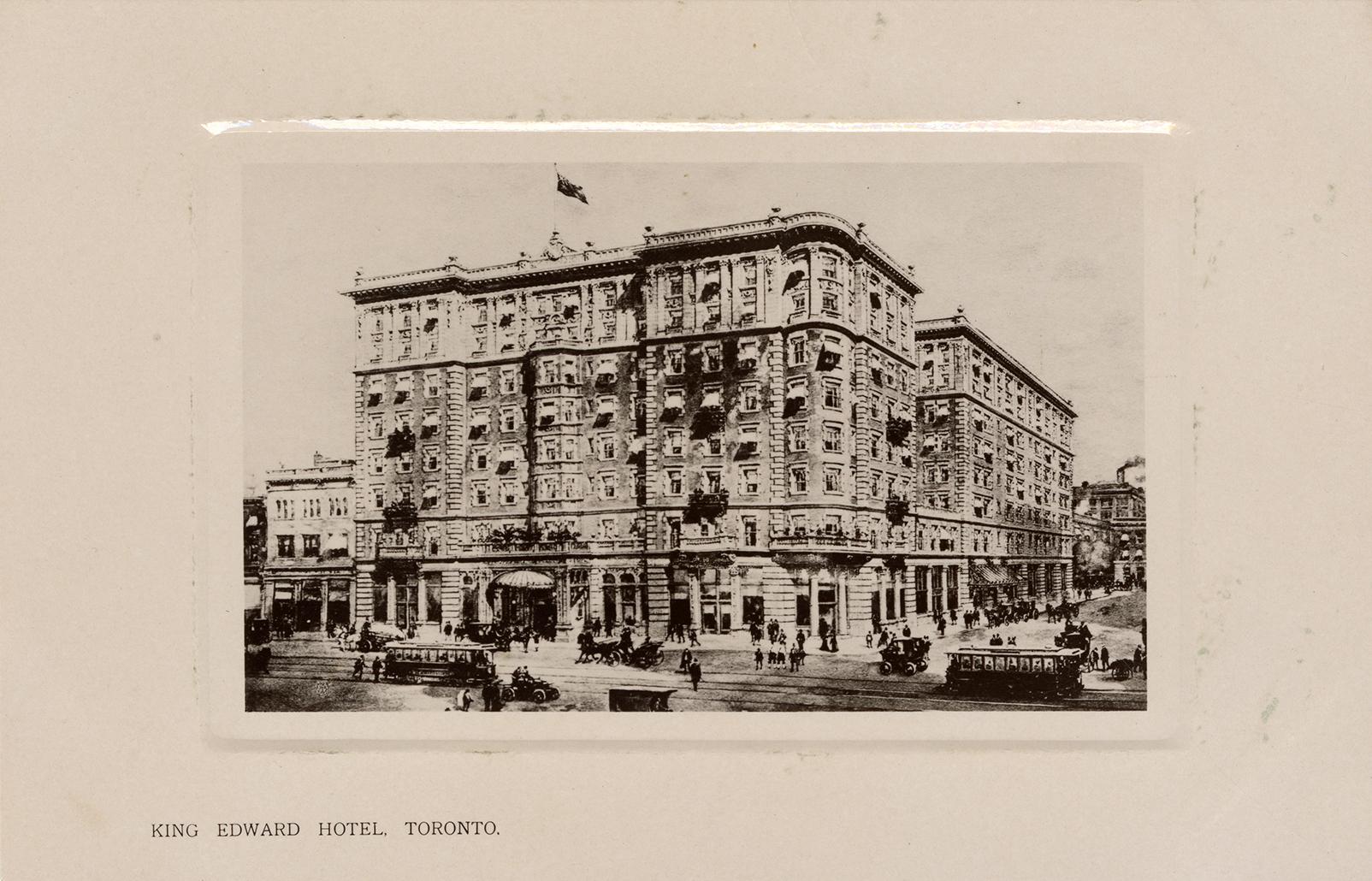 Black and white photograph of a large, multi story public building.