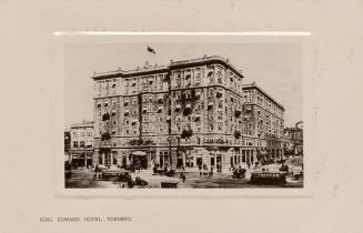 Black and white photograph of a large, multi story public building.