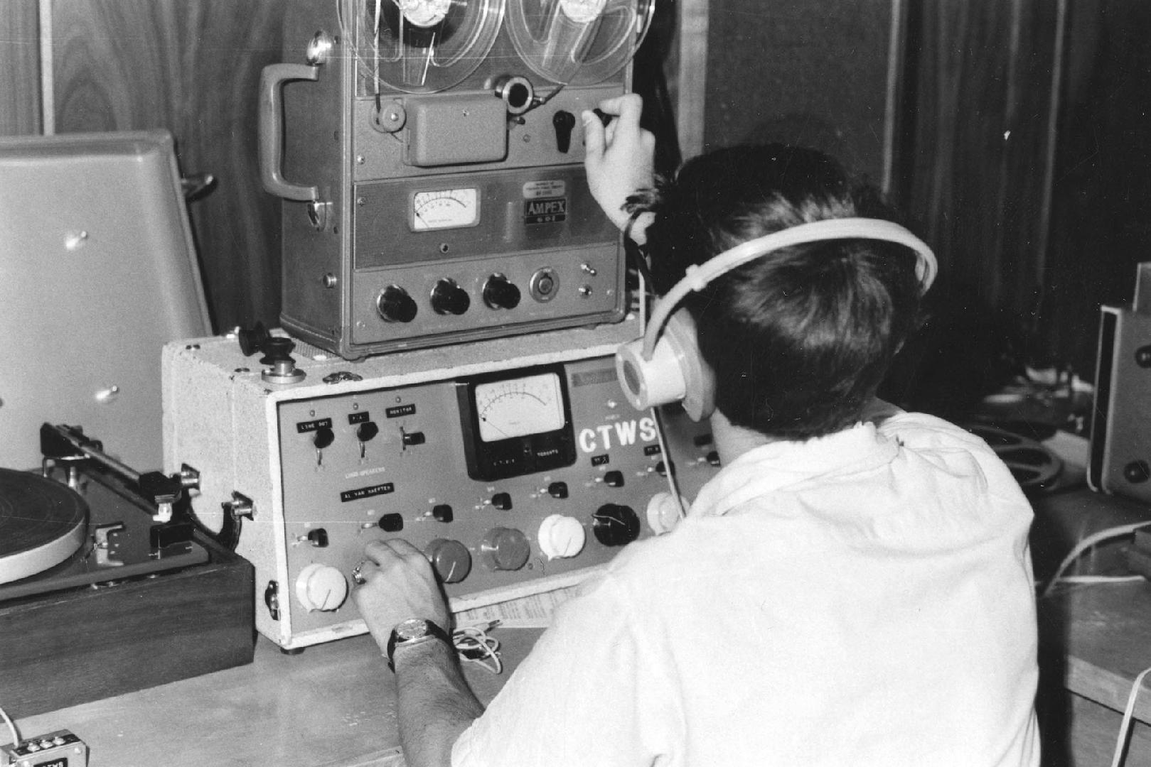 Picture of a person using recording equipment. 