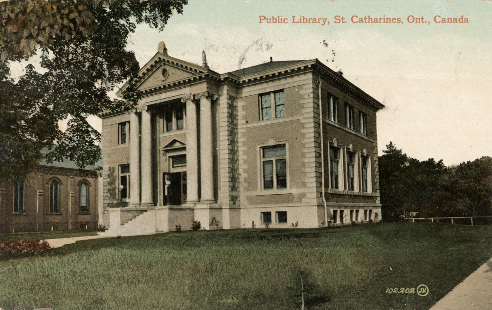 Picture of two storey library building with front pillars and portico. 