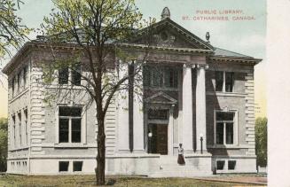 Picture of two storey library building with front pillars and portico. 