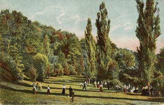 Colorized photograph of a groups of people walking in an open area of greenery with large trees ...