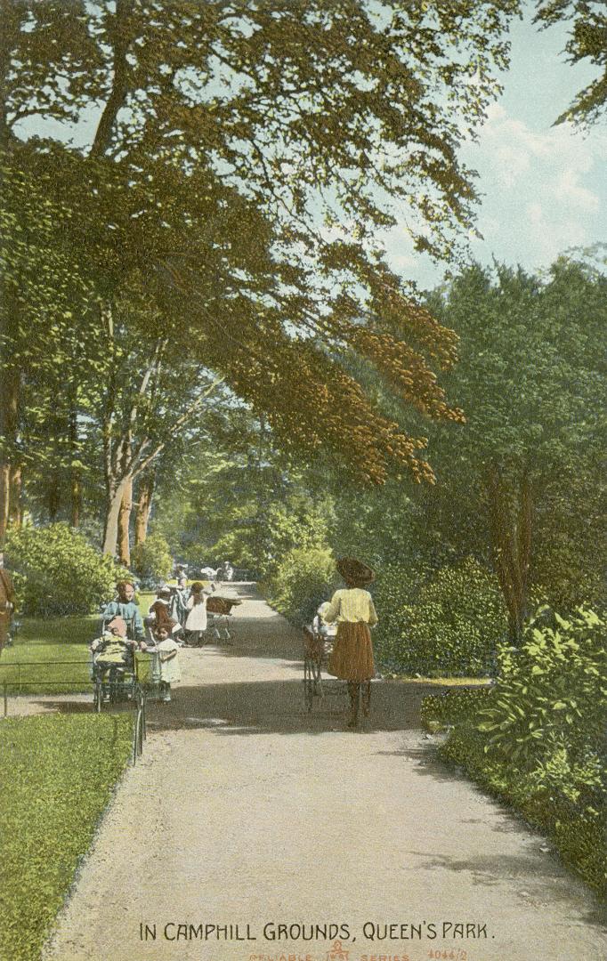 Colorized photograph of people bicycling on a path in a wooded area.