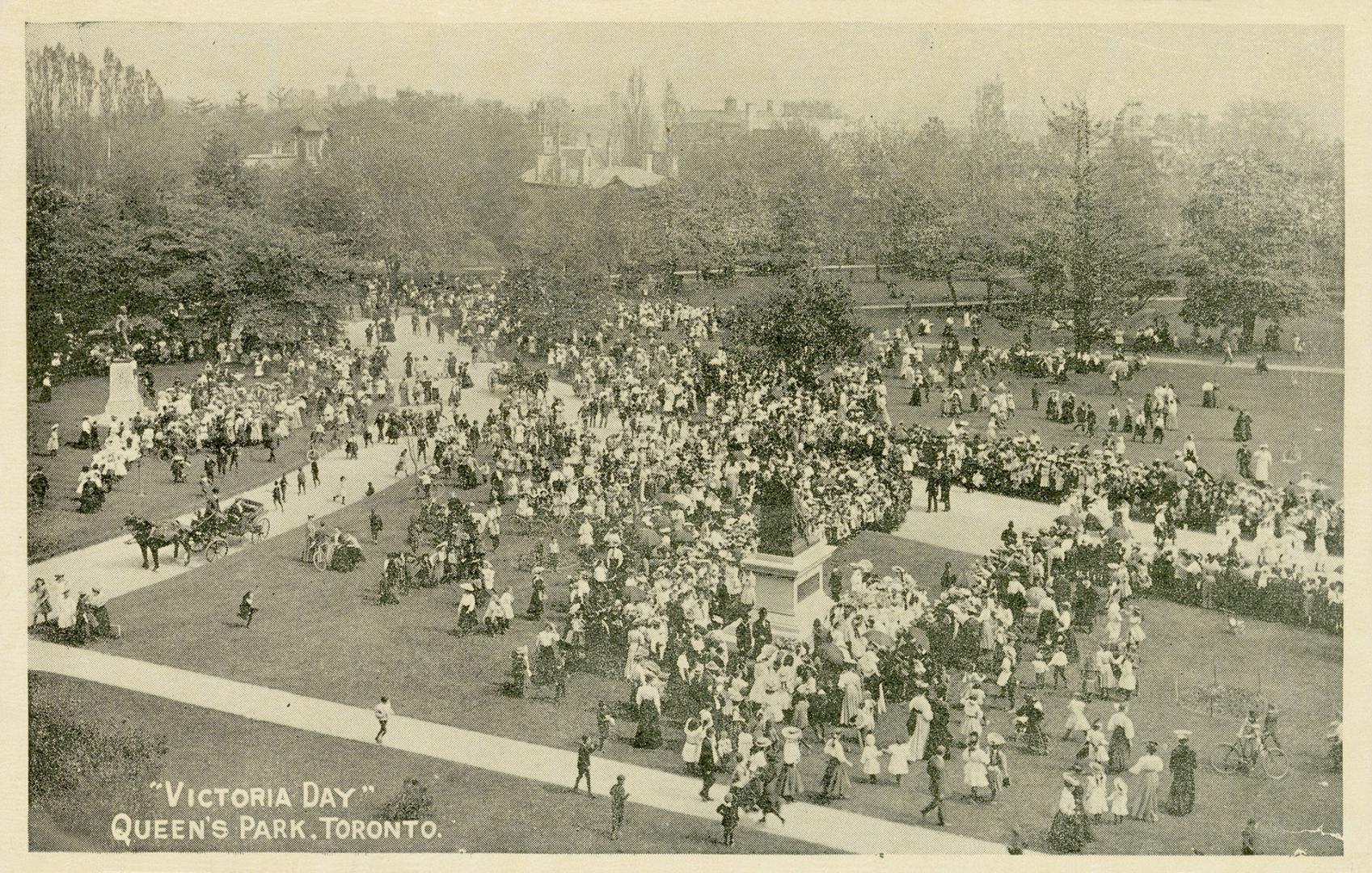 Black and white photograph of a huge crowd congregating in a park.