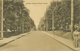 Sepia toned photograph of a treelined street.