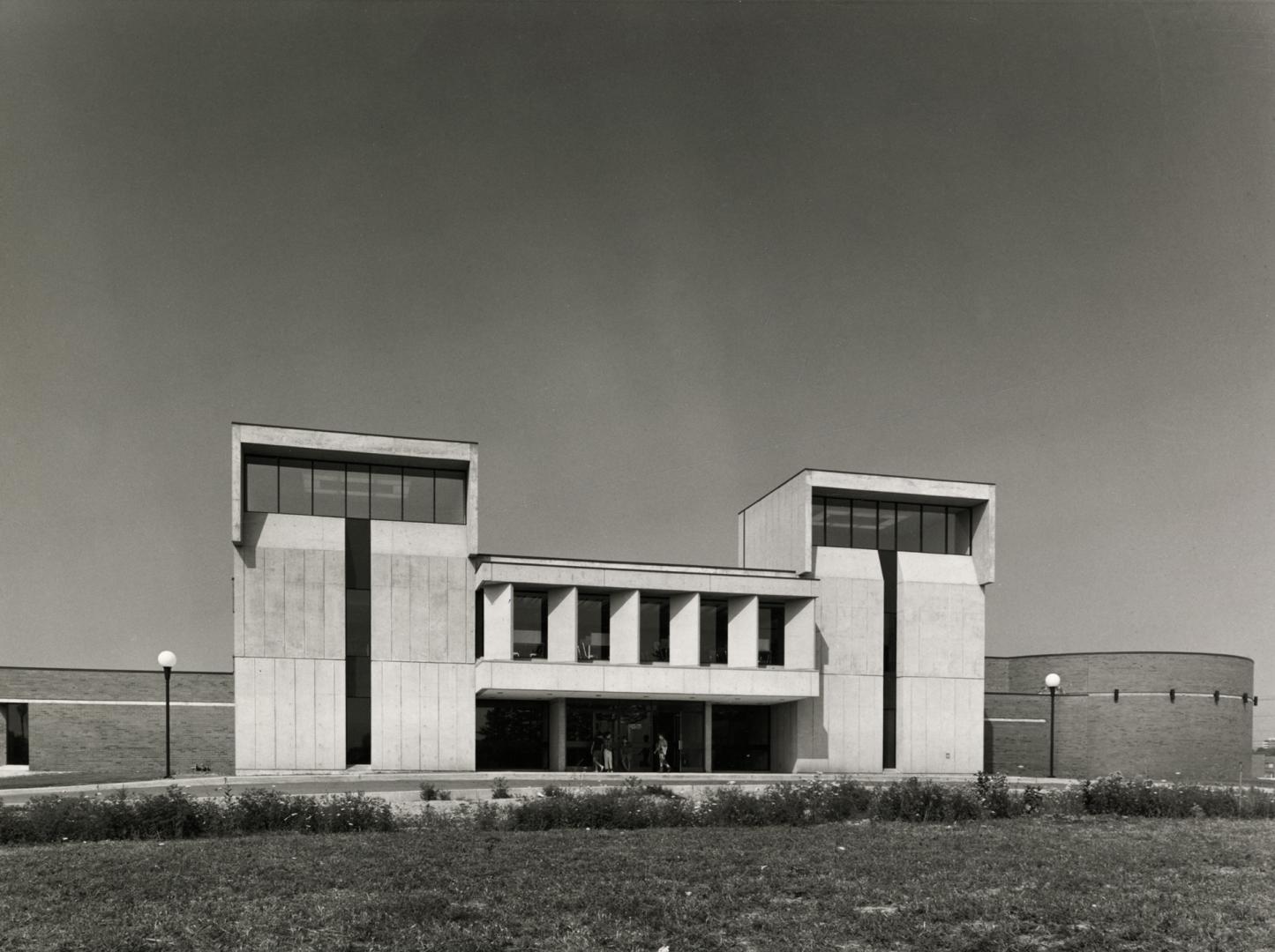 Picture of library building with two concrete towers. 