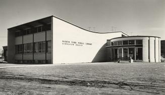 Picture of a library building with round entrance. 