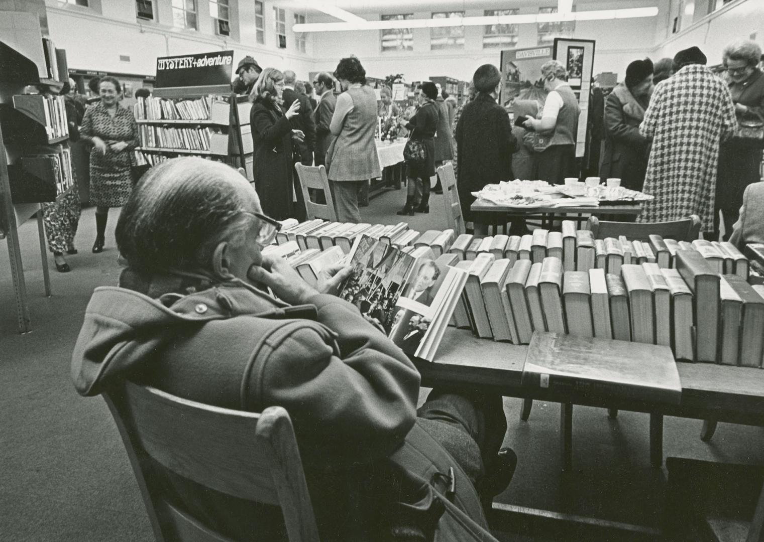 Picture of people at a library display. 