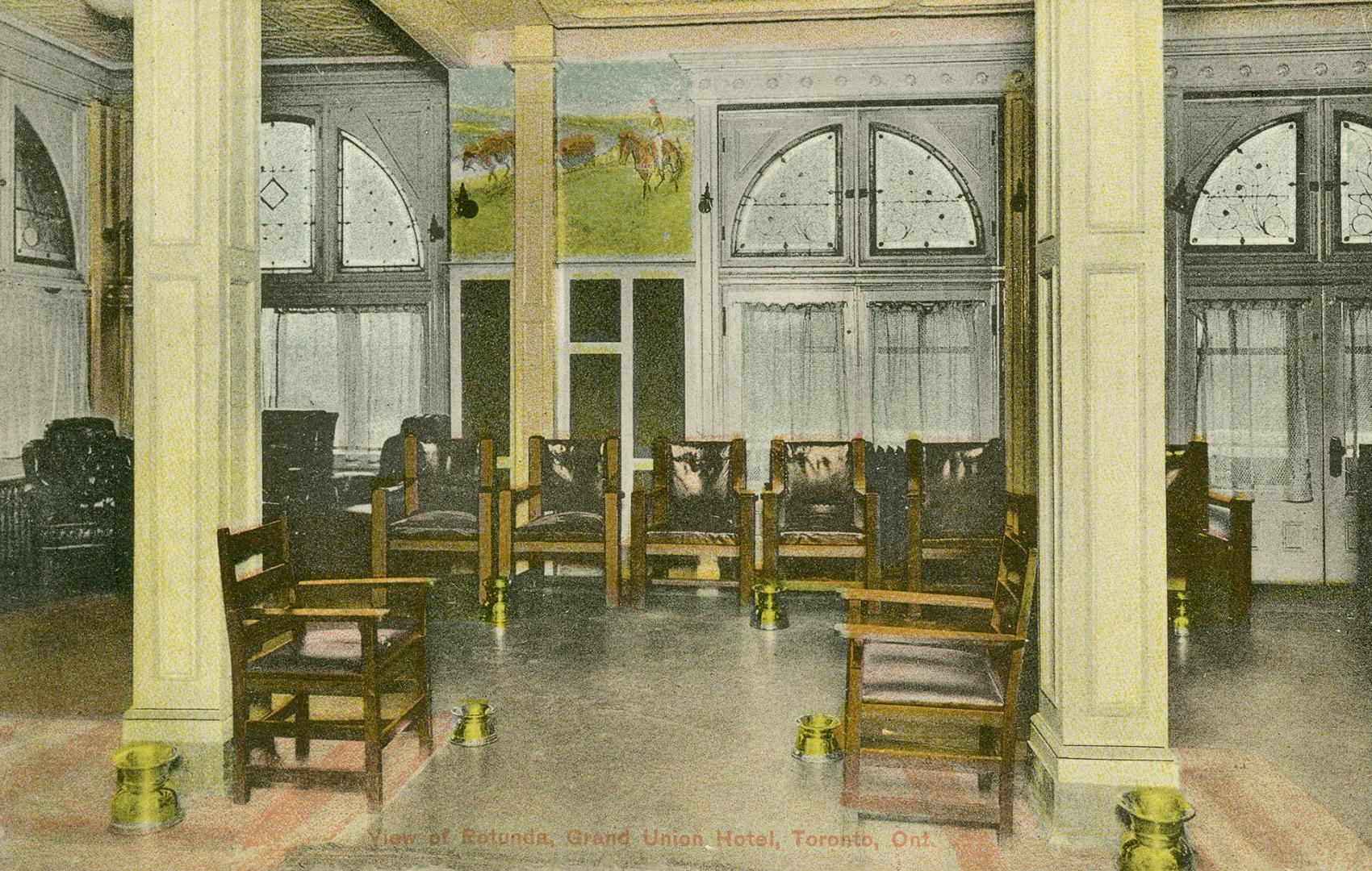 Colorized photograph of chairs in a very large room with columns.