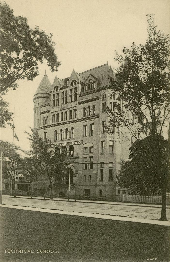 Black and white photograph of a large building with turrets.