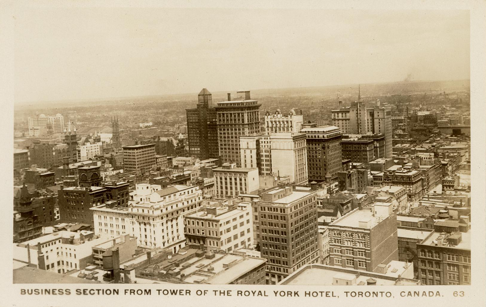 Black and white aerial photograph of skyscrapers in a large city.