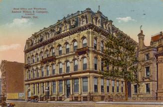 Colorized photograph of a four story second empire building.