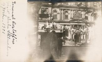 Black and white photograph of the front entrance of a public building built in the second Empir ...