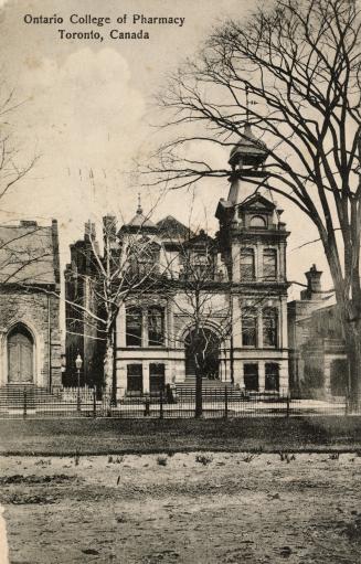 Black and white photograph of a large, Victorian, collegiate building with a turret.