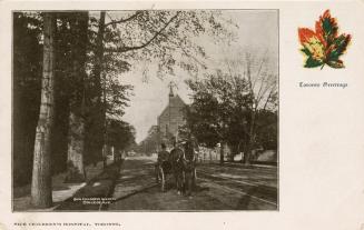 Black and white photograph of a horse and buggy on a city street with a large, Victorian buildi ...