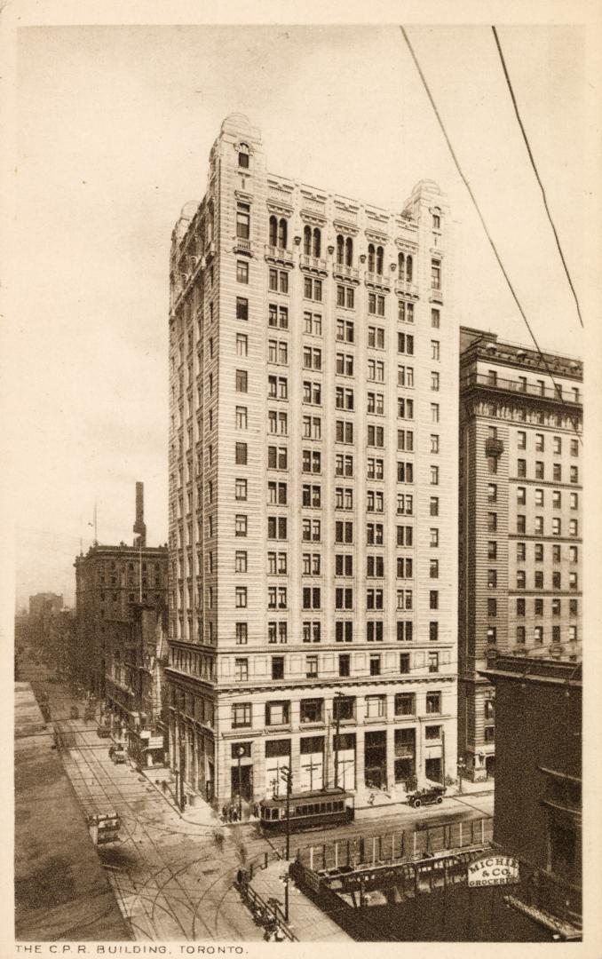 Sepia-toned photo postcard depicting the exterior view looking east on King Street from Yonge,  ...