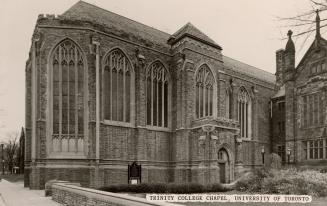 Black and while photograph of a church with gothic style windows.