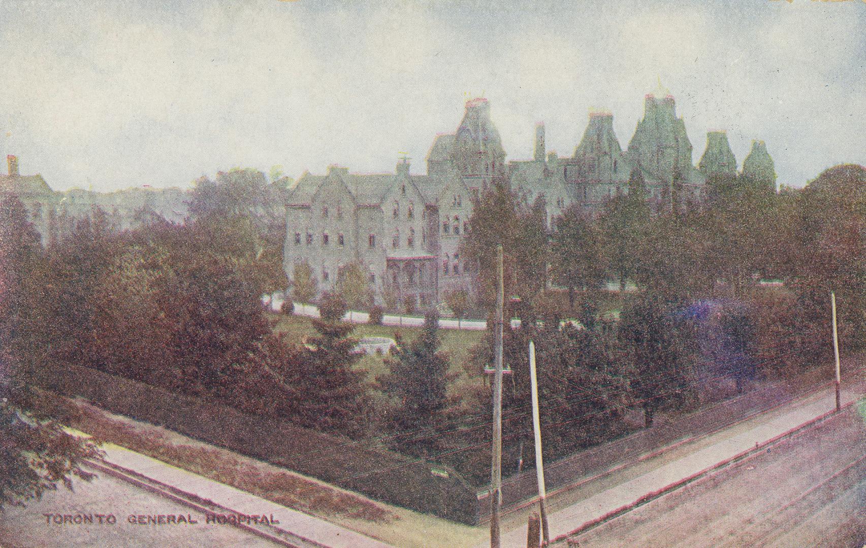 Colorized photograph of a large hospital complex surrounded by trees.