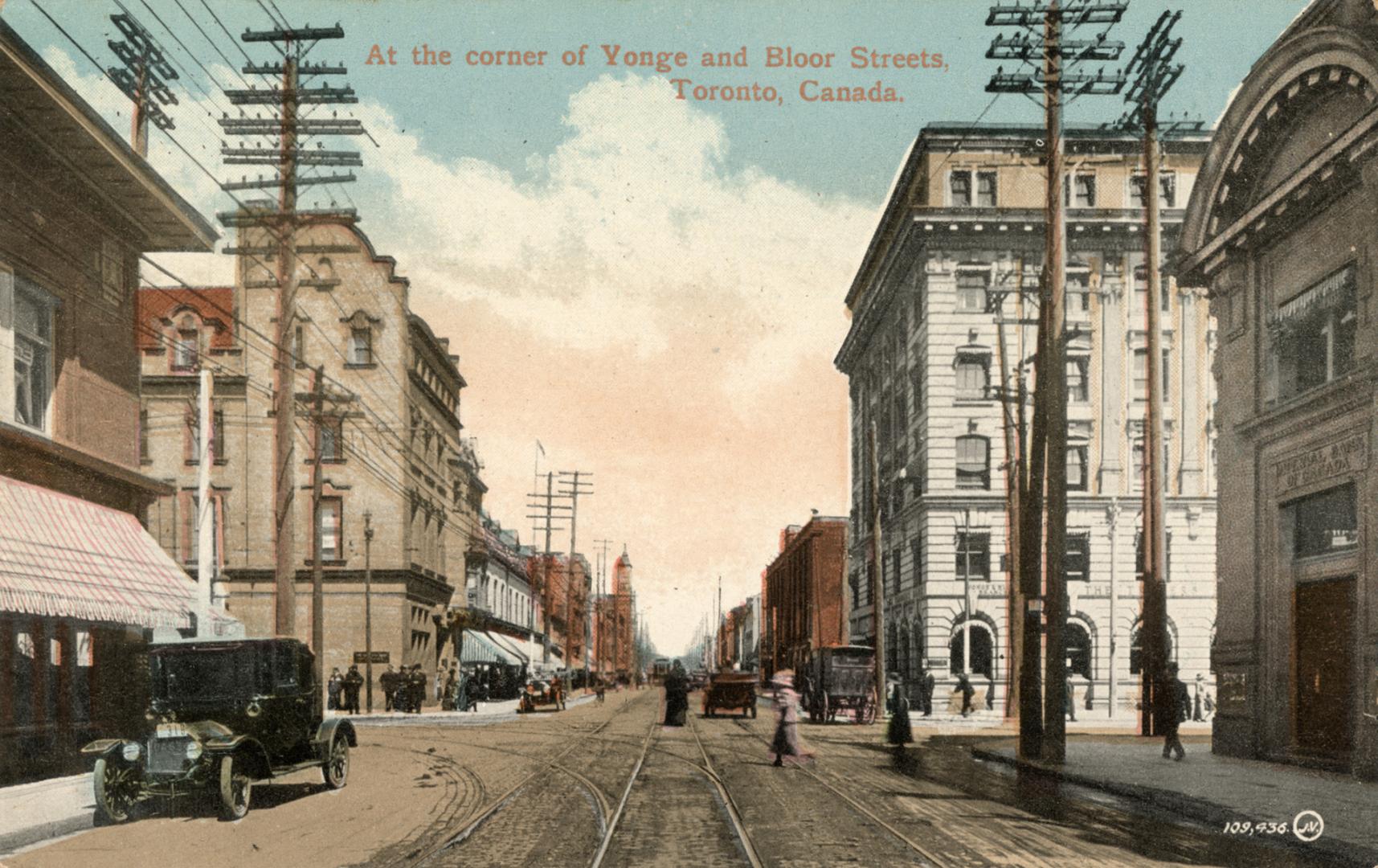 Colorized photograph of a city street with tall office buildings on either side.