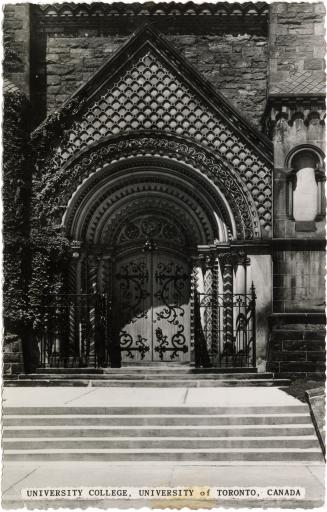 Black and white photograph of a huge, highly stylized, stone doorway.