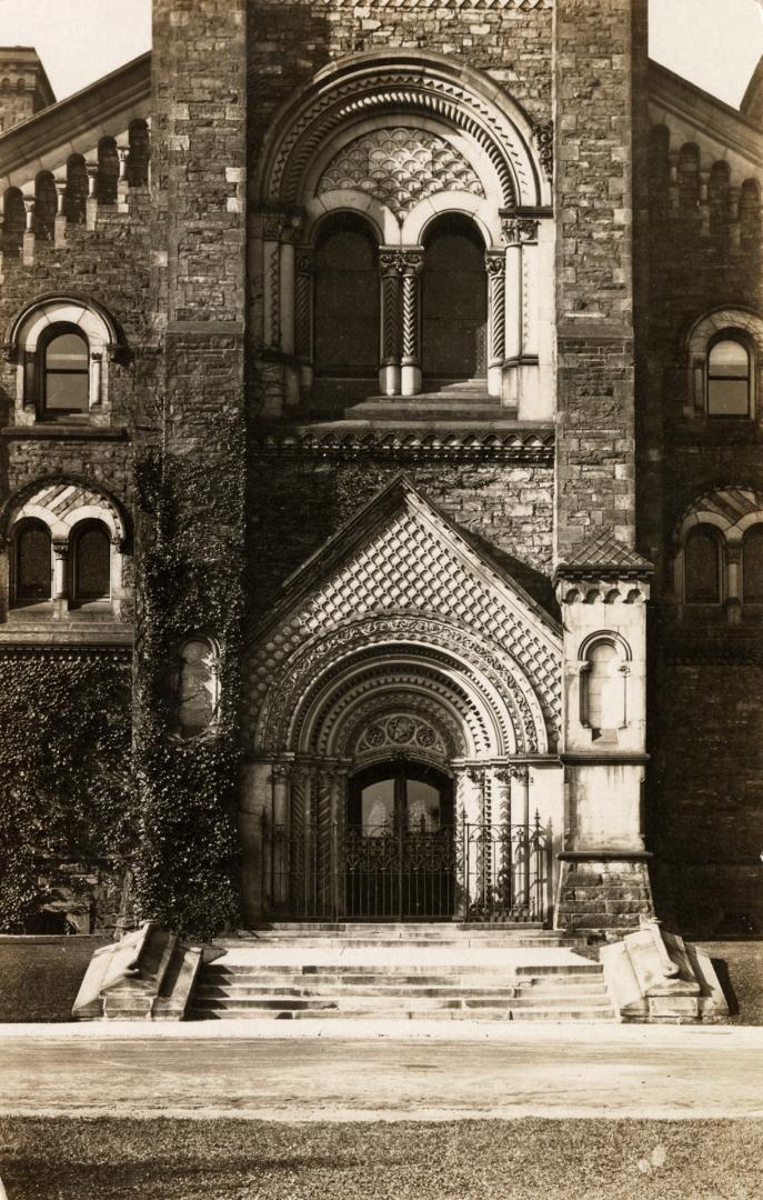 Black and white photograph of a huge, highly stylized, stone doorway.