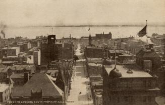 Black and white aerial photograph of a large city.