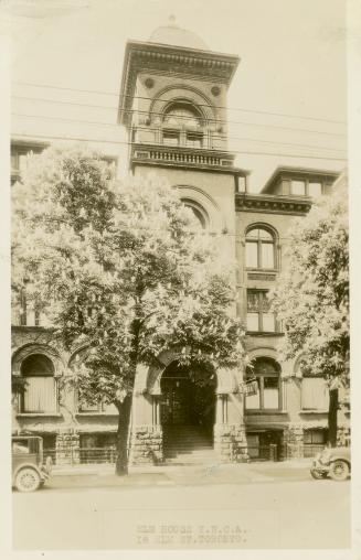 Black and white photograph of a large building constructed in the Richardsonian Romanesque styl…