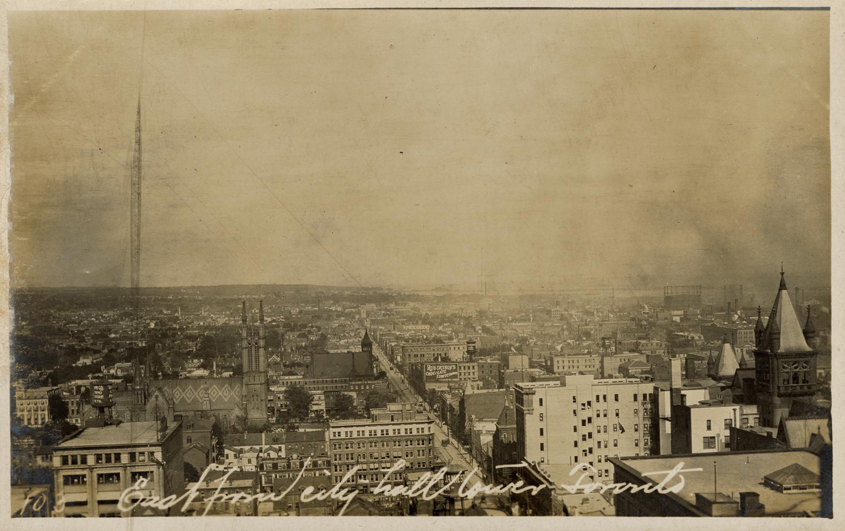 Black and white photo postcard depicting an aerial view of Toronto showing the Metropolitan Met ...