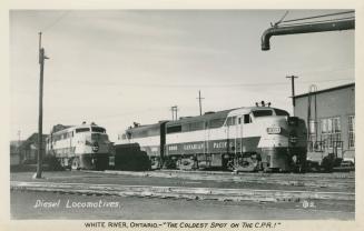 Black and white photograph of two railway locomotives.