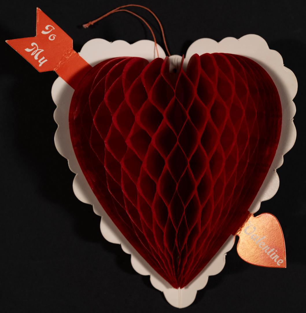 An accordion style pop-up card shaped like a heart that has been pierced by an arrow.Made in Ja ...