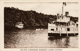 Black and white photograph of a large steamship sailing up a lake.