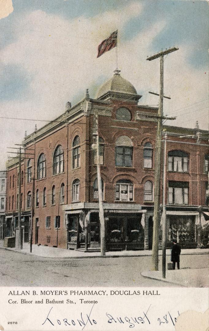 Colorized photograph of a three story, brick office building.