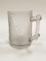A pressed glass tankard issued by Henry Greener Glass to commemorate Edward "Ned" Hanna's victo…