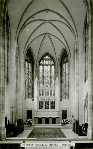 Black and white photograph of a the interior of a gothic church.