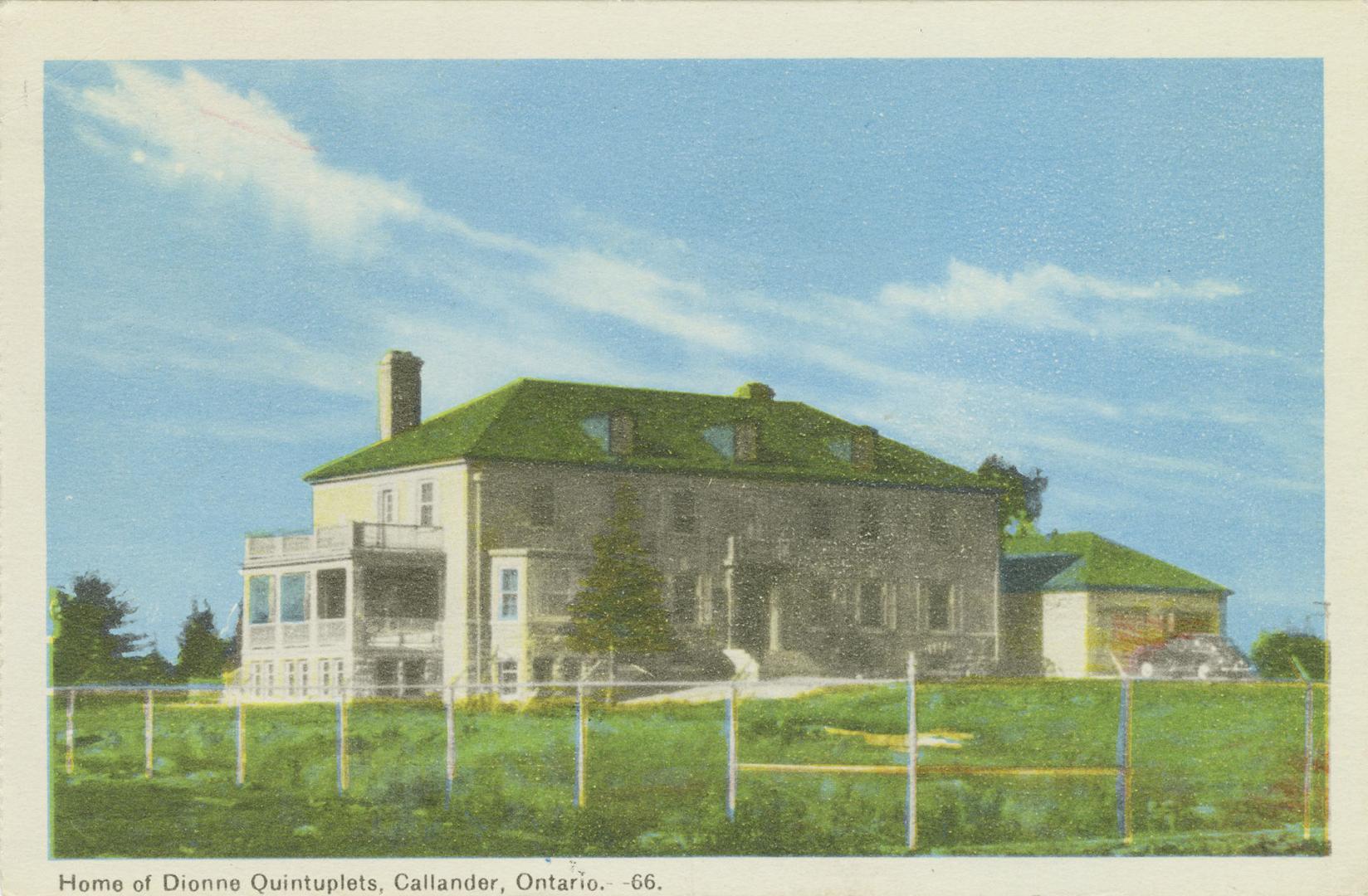 Colorized photograph of large, three story building.