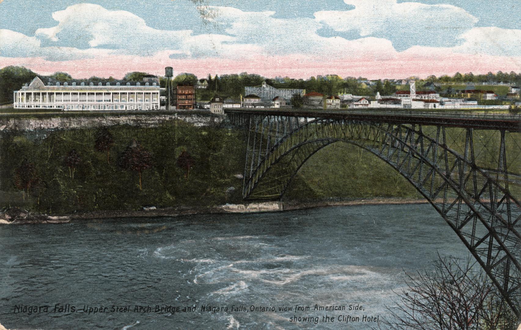 Colorized photograph of a steel bridge spanning over a river with rapids. Large, white public b ...