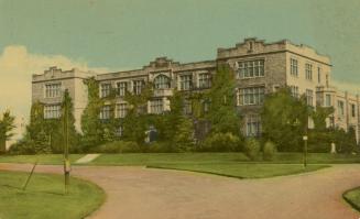 Color photograph of a three story collegiate building.