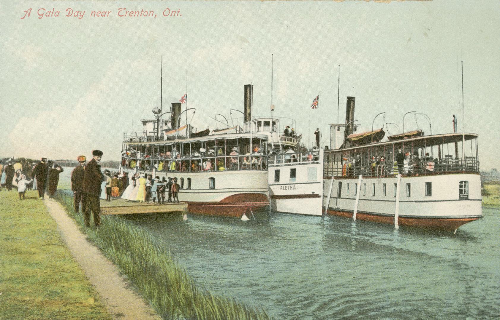 Colorized photograph of three large boats full of people beside a dock.