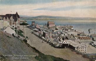 Colorized photograph of a wide street up above a town.